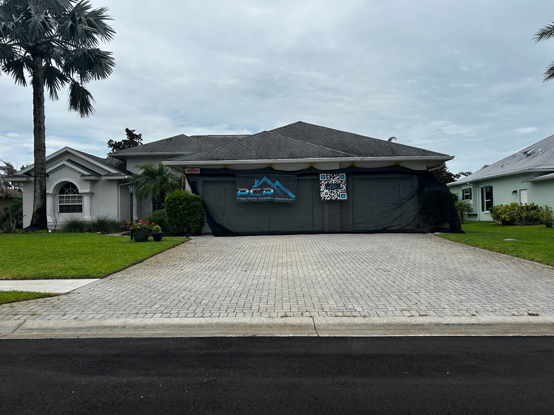 Aging Florida shingle roof showing signs of wear before replacement