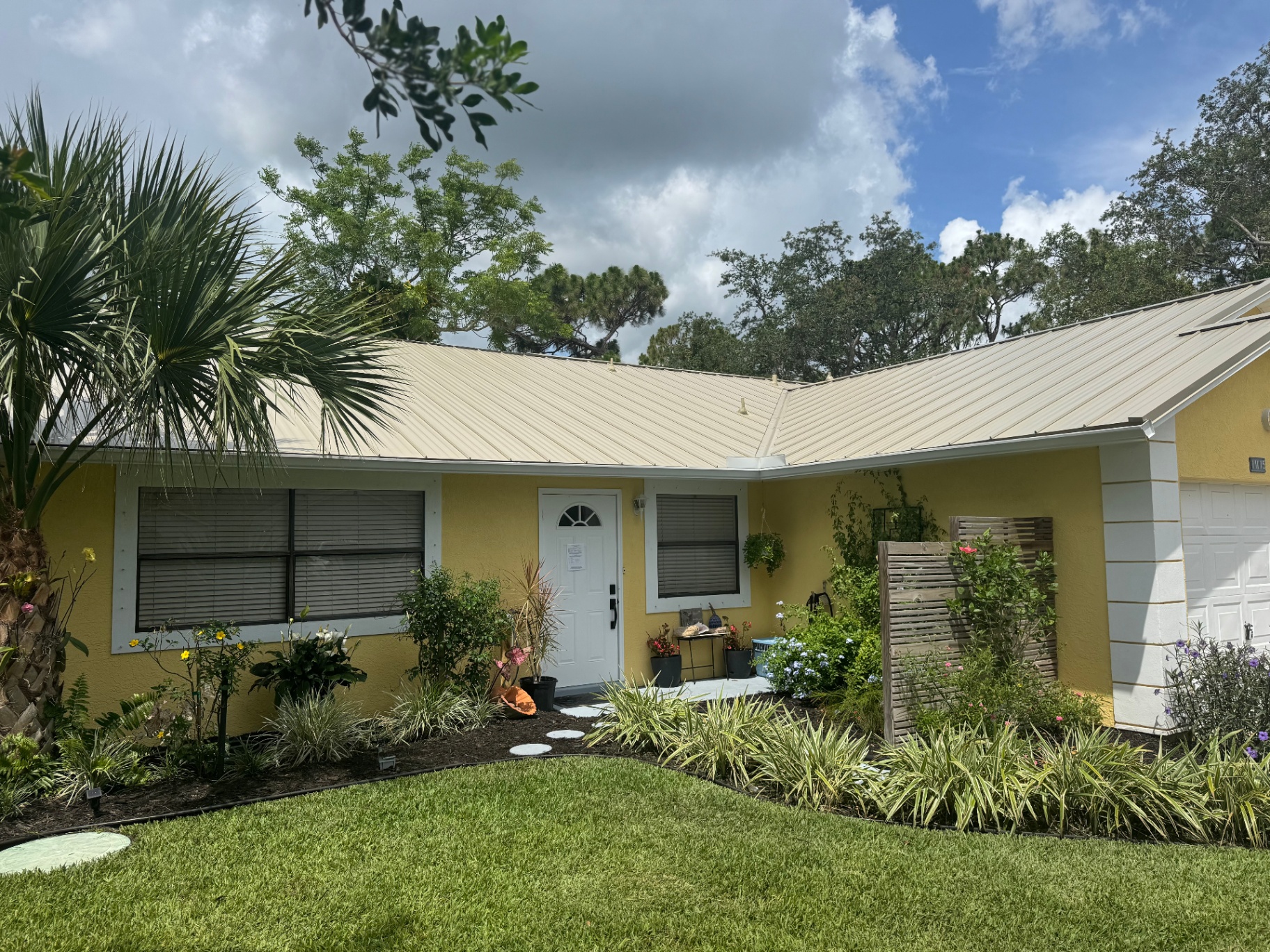Tan standing-seam metal roof inspected and installed by ProCraft Renovations in Florida
