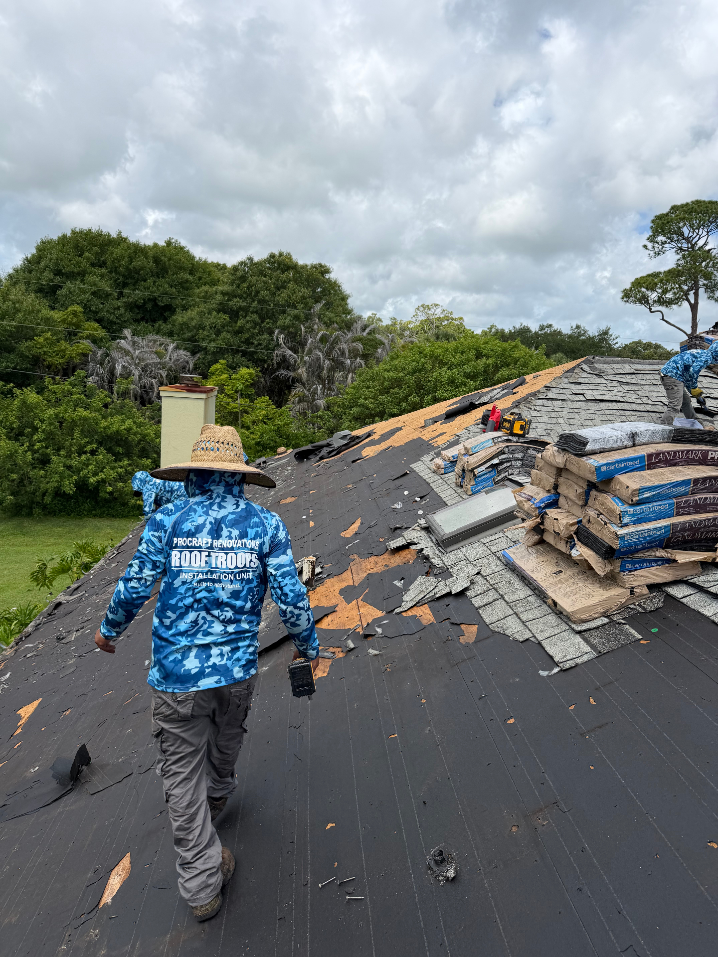 ProCraft Renovations Roof Troops crew performing a storm-damage tear-off in Florida